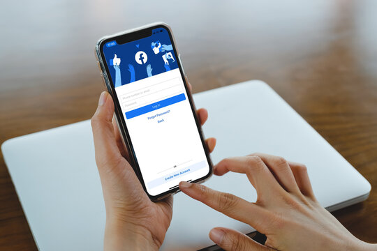 Bangkok. Thailand. March 1,2021 Facebook social media app logo on log-in, sign-up registration page on mobile app screen on iPhone smart devices in business person's hand at work