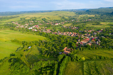 Flying over a village in Transylvania, Romania by drone