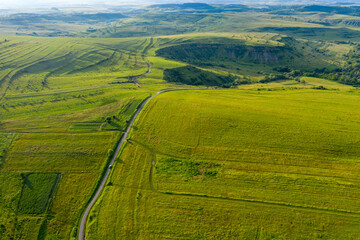 Obraz premium Above view of countryside road, aerial view