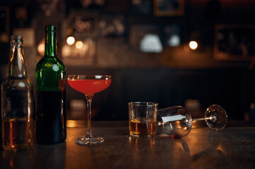 Different alcohol beverages on counter in bar