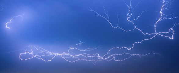 Beautiful flash of lightning in the night sky during a thunderstorm