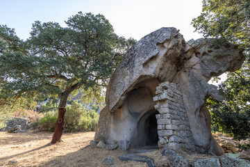 Fototapeta na wymiar Conca Fraicata house built in the rock , Calangianus, Sardinia, Italy, Europe
