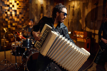 Two musicians with accordion and electric guitar