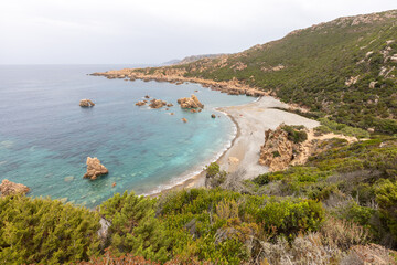 beautiful beach and characteristic reddish rocks of Cala Tinnari,  Paradiso. Trinit?� d'Agultu e Vignola, Sardinia, Italy, Europe