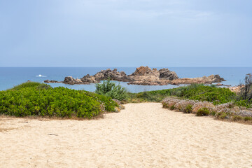 beautiful beach and characteristic reddish rocks of Cala Caneddi. Trinità d'Agultu e Vignola,...