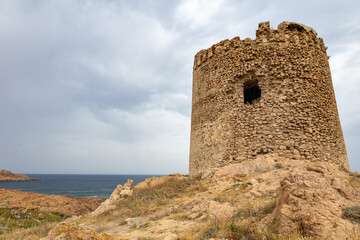 Aragonese Tower and characteristic reddish rocks of Isola Rossa, Costa Paradiso. Trinità d'Agultu e Vignola, Sardinia, Italy, Europe