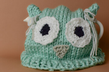 cute hand knit owl tea cosies on teapot