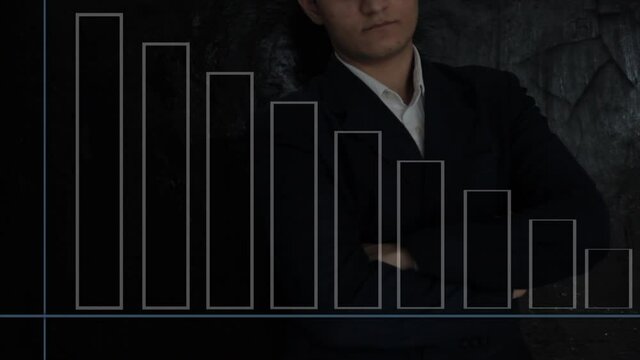 A young successful businessman with some decreasing graph analyzing graphs high-quality footage 4K resolution Apple ProRes.