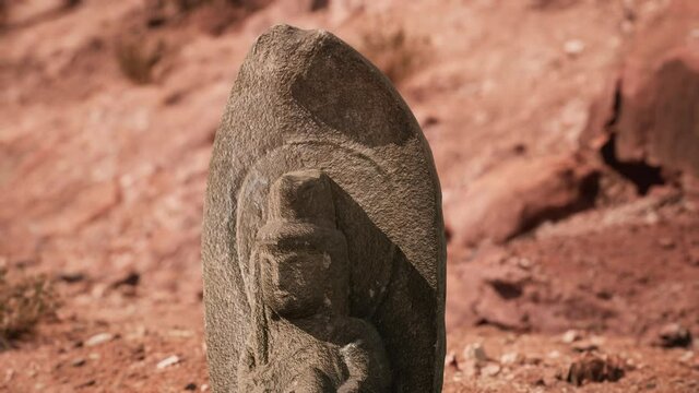 Ancient Statue on the Rocks Desert