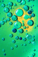 oil bubbles with water on glass