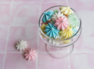 Small colorful meringues in the glass