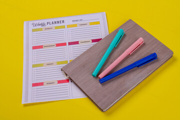 Felt-pens on the book and week calendar.