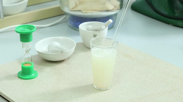 the laboratory assistant checks the products of the food factory for composition and quality