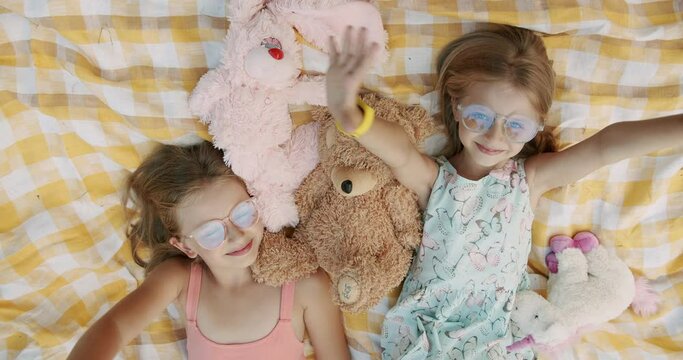 Cute little girls smiling and looks like to webcam making online video call 