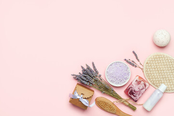 Lavender cosmetics  background. Sea bath salt, face roller, wooden brush and flowers. Aromatherapy, spa. Top view . Flat lay. Copy space.
