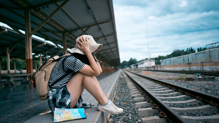 Young girl passenger feeling disappointed missed the train departure earlier than expected. upset traveling and late trip dissatisfied.