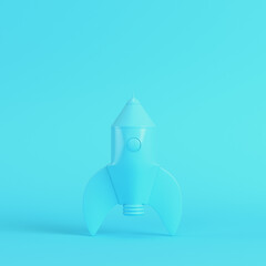 Cartoon styled rocketon bright blue background in pastel colors