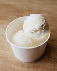 Balls of sweet creamy ice cream in a box - homemade dessert from mom to children - a favorite treat for the whole family