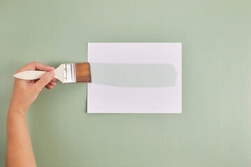 Happy Left Hander's Day. Left hand hold brush and writing text.