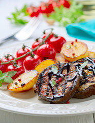 Eggplant steaks with vegetables.