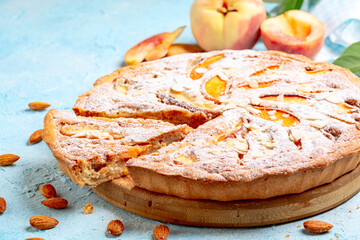 Open pie with peaches and frangipane.