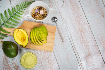 Fototapeta na wymiar healthy eat and lifestyle with avocado slice ,smoothie and breakfast on wooden background
