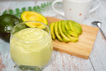 healthy eat and lifestyle with avocado slice ,smoothie and breakfast on wooden background