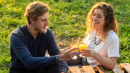 A happy couple resting in the nature at glamping