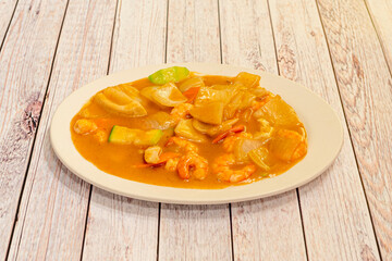 Great Shrimp Curry Tray with Sauteed Vegetables and Onions Cooked in a White Chinese Restaurant