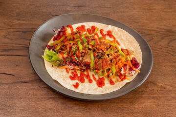 Open Lebanese Durum with Stewed Lamb, Peppers, Carrots and Kale Roa with Tomato Sauces and Mayonnaise on a Wheat Tortilla