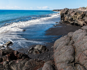 Fototapeta na wymiar Sea Cliffs Formed by Recent Lava Flows on Kaimu Black Sand Beach, Hawaii Island, Hawaii, USA