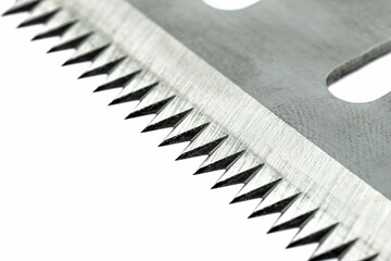 A macro photo of a serrated industrial blade for tape cutters, isolated on a white background.