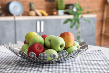 Plate with fresh apples on dining table, closeup