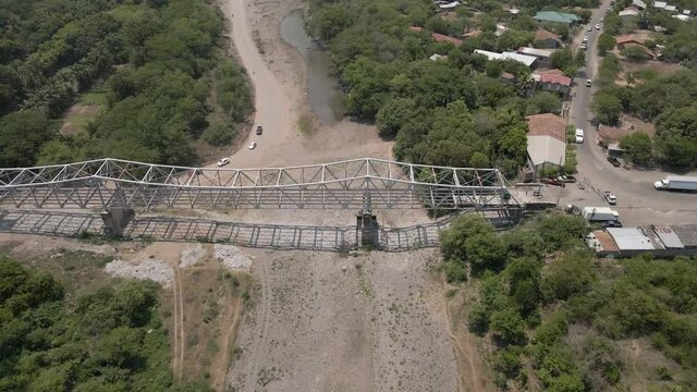 Reverse and tilt up footage over a river that is dried because of climate change effect