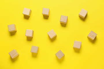 Fototapeta na wymiar Wooden cubes on color background