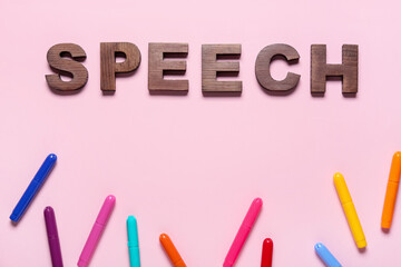 Word SPEECH and markers on color background