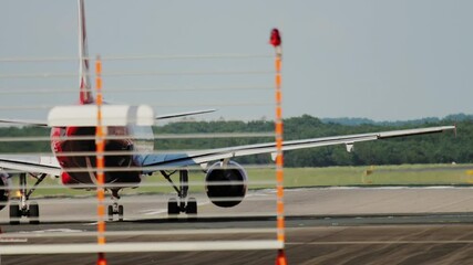 Plane, rear view, at the start of the runway