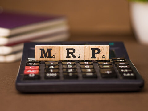 Assam, india - March 30, 2021 : Word MRP written on wooden cubes stock image.