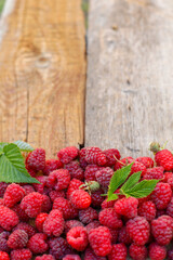 raspberries on a wooden table, raspberries on wooden background