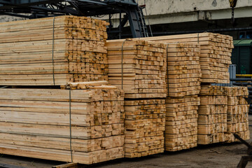 Stacks of timber ready for shipment in sea port in Ukraine