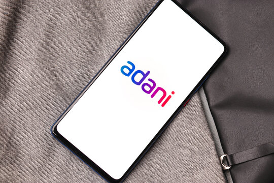 Assam, india - January 15, 2020 : Adani logo on phone screen stock image.
