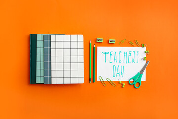 Paper with text TEACHER'S DAY and stationery on color background
