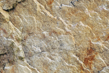 Structure of surface of the stone, used as background. Stone texture. Natural rocks