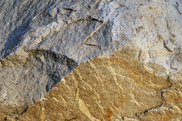 Structure of surface of the stone, used as background. Stone texture. Natural rocks