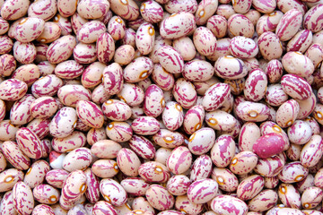 Red and white beans as a background to describe the preparation of legumes. View from above. Large