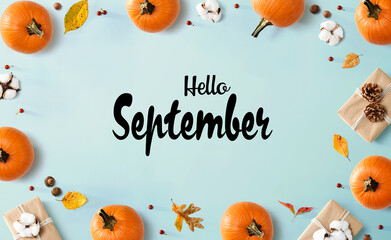 Hello September message with autumn pumpkins with present boxes © Tierney