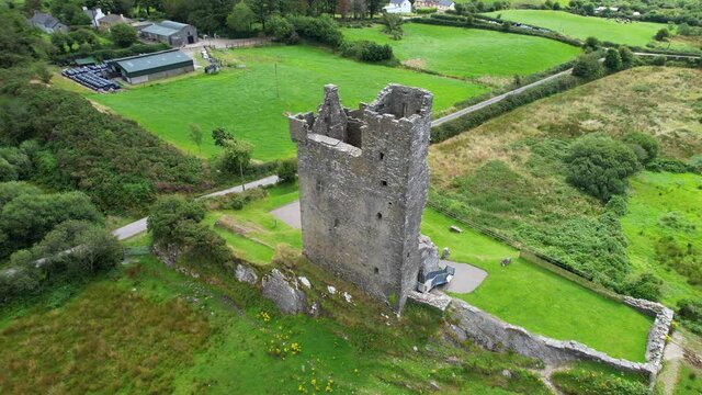 Aerial view of Castle Donovan, the remains of an Irish tower house in a valley near Drimoleague in Ireland