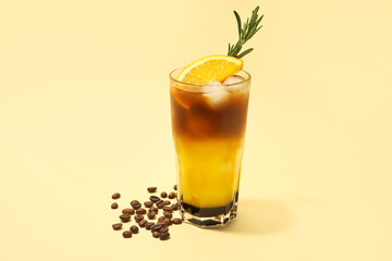 Glass of tasty coffee with orange juice on color background