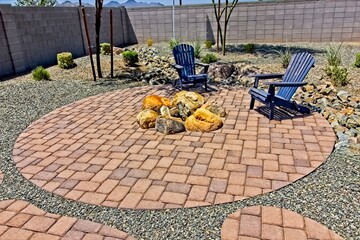 Conversation Area With Two Arm Chairs And Firepit On Pavers