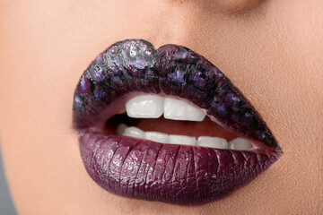 Fototapeta premium Beautiful young woman with unusual makeup, closeup